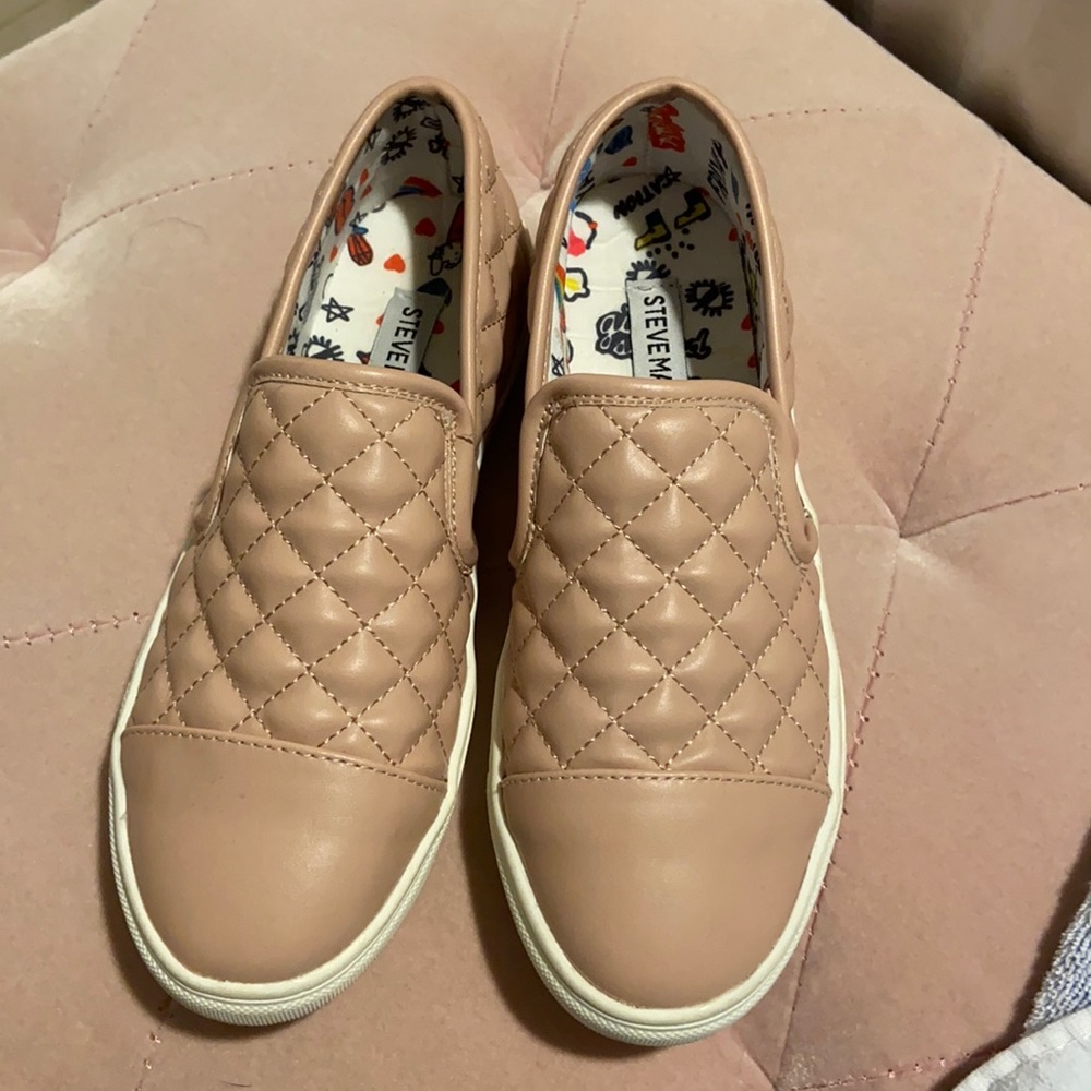 Rose colored vans style quilted shoes.